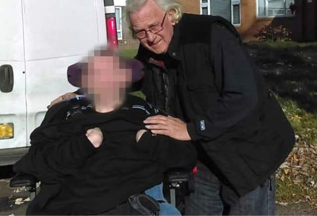 Mark Bates with his son Matthew, pixelated at request of his family (Family handout/PA)