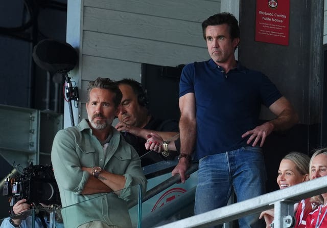 Wrexham co-owners Ryan Reynolds (left) and Rob Mac in the stands