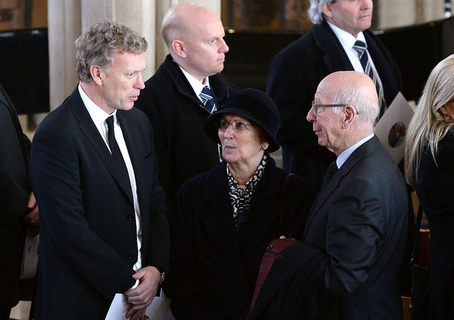 Former Manchester United manager David Moyes (left) and Sir Bobby Charlton (right) with his wife Norma (second right)