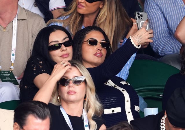 Charli XCX and Mabel pose for a selfie in the Wimbledon crowd