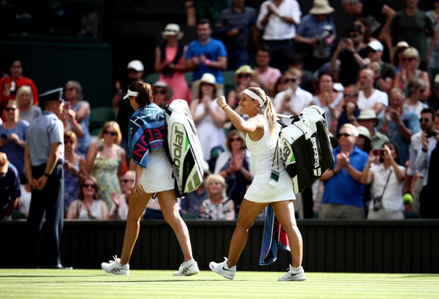 Konta walks off court after losing to Dominika Cibulkova at Wimbledon