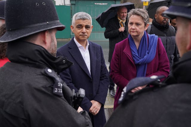 Mayor of London Sadiq Khan and shadow home secretary Yvette Cooper speak with police officers during a visit to Earlsfield Police Station, south west London. 
