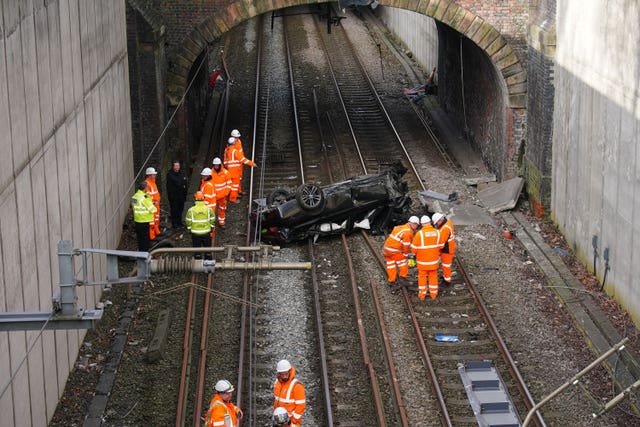 Car on train tracks in Salford