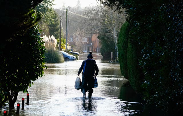 Person walking through flood water 