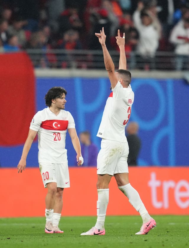 Turkey’s Merih Demiral, right, makes a 'wolf' shape with each hand after scoring his side’s second goal against Austria