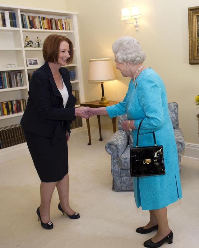 Foremr Australian prime minister Julia Gillard greets the Queen
