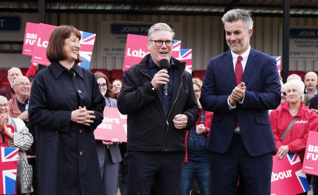 Labour Party leader Sir Keir Starmer (centre) and shadow chancellor Rachel Reeves celebrate with David Skaith at Northallerton Town Football Club