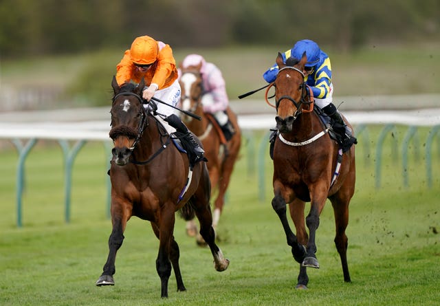 Rajinsky and Harry Davies (orange) coming home to win the Barry Hills Further Flight Stakes at Nottingham