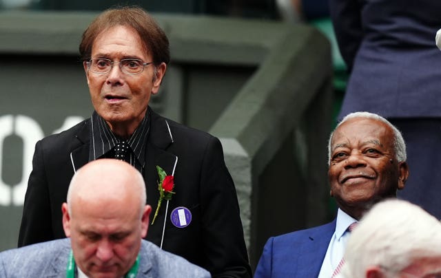 Sir Cliff Richard standing next to Sir Trevor McDonald at Wimbledon