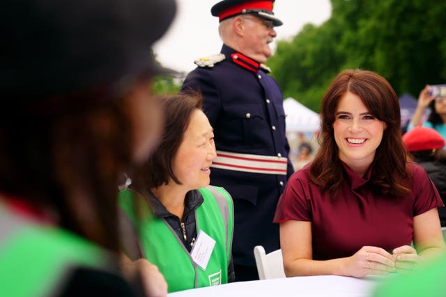 Princess Eugenie speaks to people at the lunch 