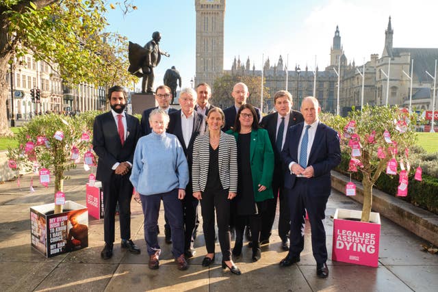 Kim Leadbeater, centre, and MPs in Parliament Square 