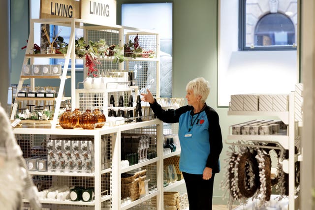 Primark colleague Mary Flynn adjusts a display in the new store