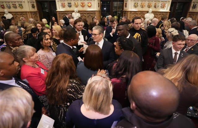 Sir Keir Starmer (centre) speaks with guests during a reception to highlight the inspirational work of paid and unpaid carers