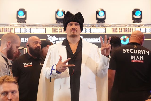 Oleksandr Usyk poses for photos