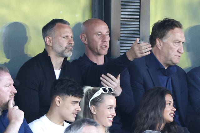 Former Manchester United team-mates Ryan Giggs and Nicky Butt sit next to each other in the stand