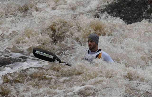 Mike Lambert paddling a canoe