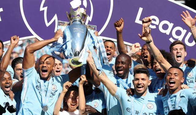 Vincent Kompany lifts the 2018 Premier League title