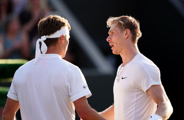 Denis Shapovalov (right) and Liam Broady shake hands