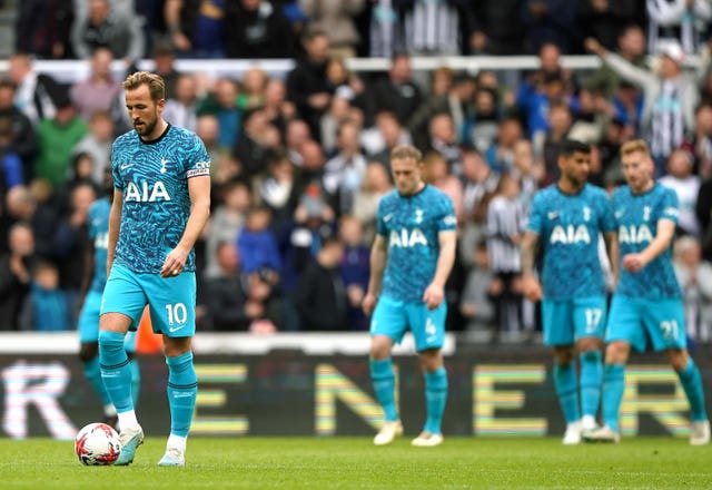 Tottenham striker Harry Kane (left) walks away after Newcastle scored
