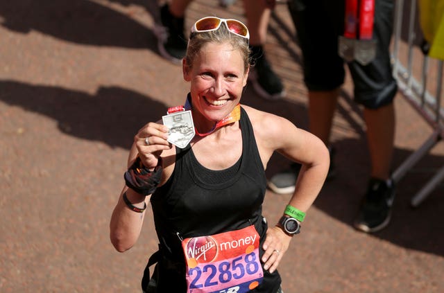 TV presenter Sophie Rayworth poses with her medal after completing the race (Paul Harding/PA)