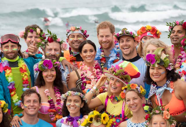 The Duke and Duchess of Sussex joined One Wave members in colourful outfits (Paul Edwards/The Sun/PA)