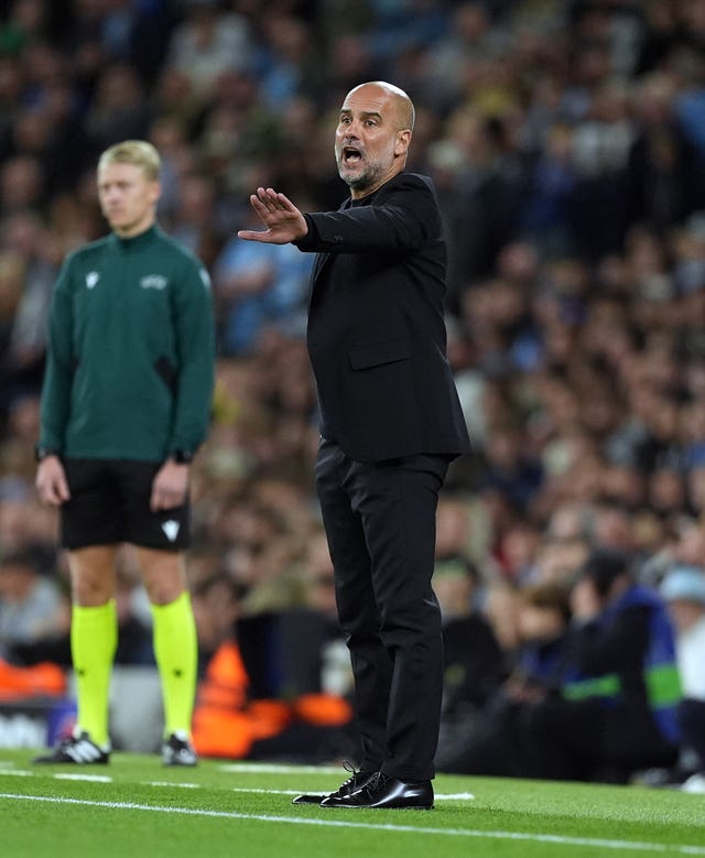 Pep Guardiola on the touchline during a game