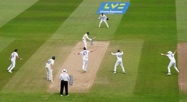 Khawaja is bowling as four of the six catchers look on.