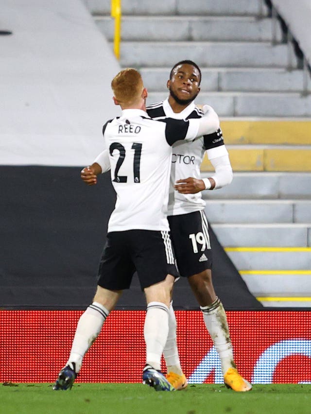 Ademola Lookman celebrates with team mate Harrison Reed after putting Fulham in front against relegation rivals Sheffield United.