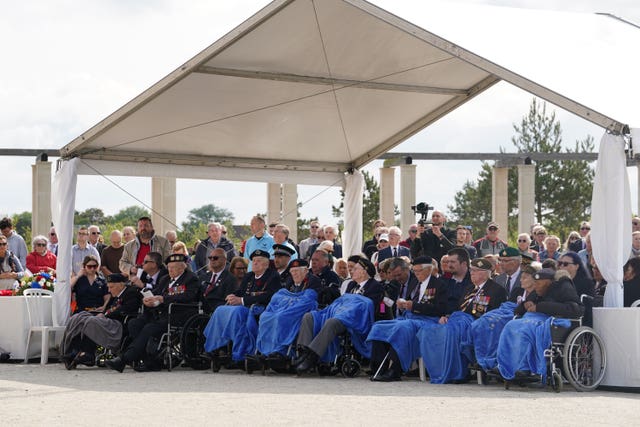 (Left to right) Royal Navy D-Day veteran John Dennett, D-Day veteran and ambassador for the British Normandy Memorial Ken Hay, Royal Navy D-Day veteran Henry Rice, Royal Marines D-Day veteran Jim Grant, Royal Navy D-Day veteran Ken Benbow, Royal Navy veteran George Boothby, D-Day Army veteran Richard Brock, ATS veteran Marjorie Hanson and RAF veteran Gilbert Clarke during a wreath-laying ceremony at the British Normandy Memorial in Ver-sur-Mer, France