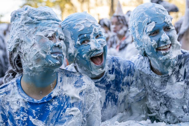 Students covered in shaving foam