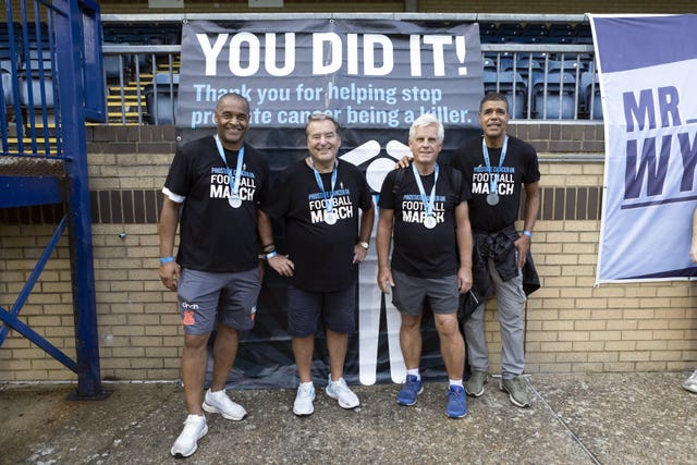 Mark Bright, Jeff Stelling, Steve Rider and Chris Kamara (far right) after finishing a charity march in aid of Prostate Cancer UK