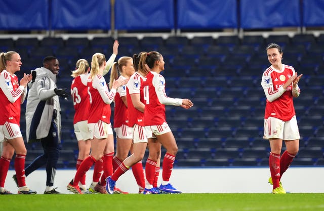 Arsenal celebrate progressing in the Champions League