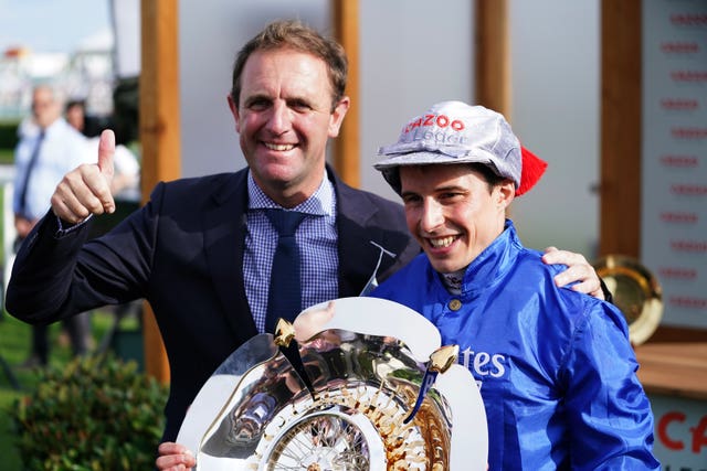 Charlie Appleby and jockey William Buick celebrate winning the St Leger with Hurricane Lane