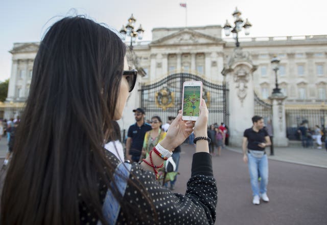 Pokemon Go being played outside Buckingham Palace