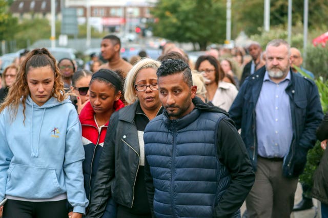 The aspiring sprinter's family paid respects to him at Hillingdon station (Steve Parsons/PA)