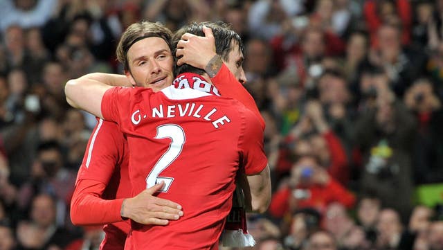 Manchester United’s Gary Neville and David Beckham embracing on the football pitch while playing for Manchester United