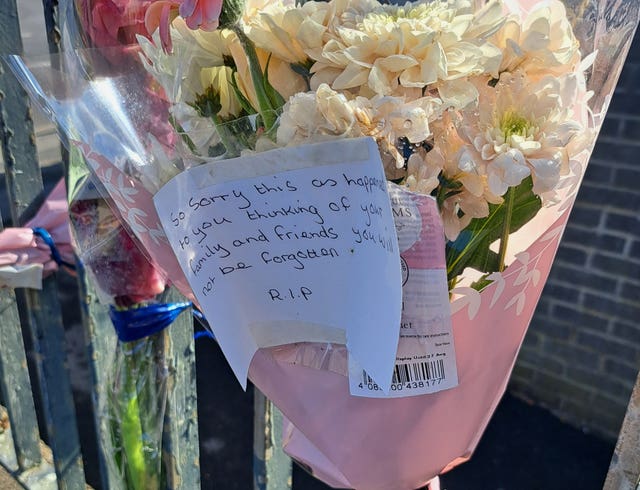 Floral tributes left at the scene in Heights Drive, Wortley, following the death of parcel delivery driver Claudiu-Carol Kondor