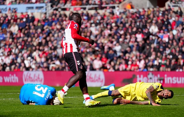 Sunderland’s Brian Brobbey (centre) looks on after pushing Tottenham Hotspur’s Cristian Romero (right) into Tottenham Hotspur goalkeeper Antonin Kinsky