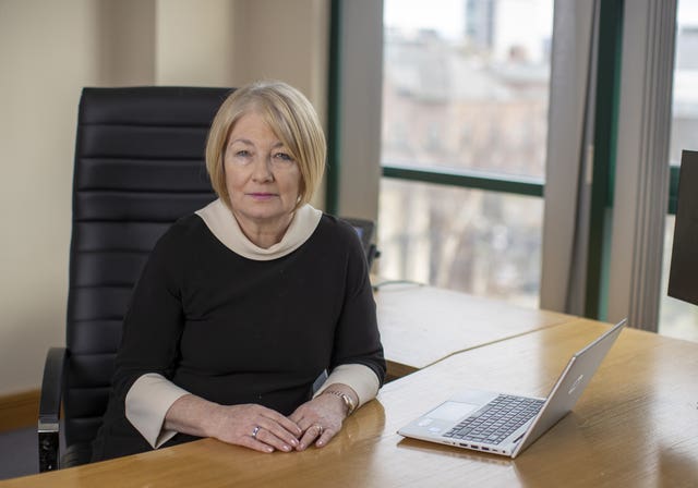  Ombudsman Marie Anderson sat at a desk