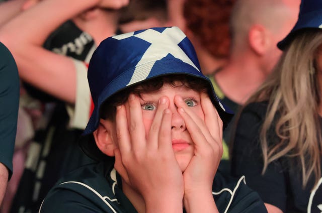 A Scotland fan watches at the OVO Hydro arena