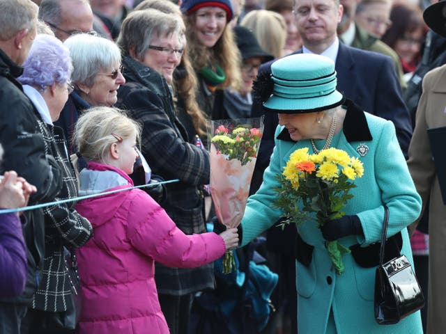 The Queen receives flowers during a walkabout after a church service at St Peter and St Paul West Newton in Norfolk (Gareth Fuller/PA)