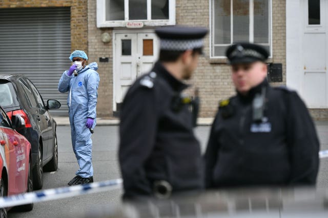 Forensic investigators at the scene in south-east London 