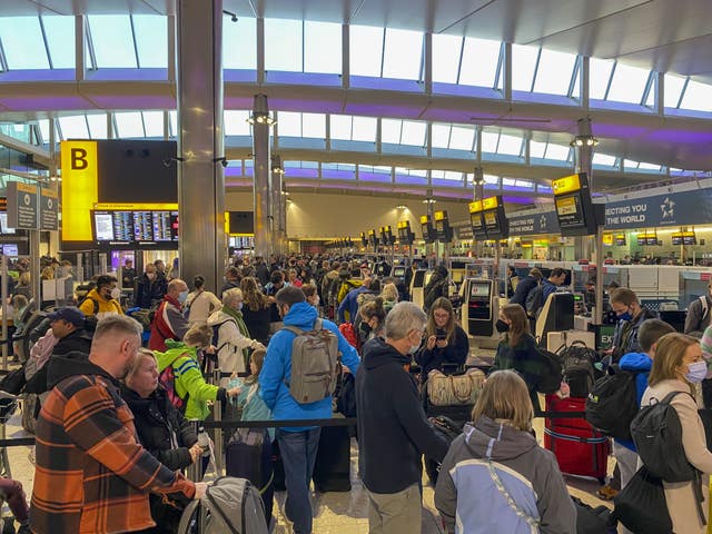 Passengers check-in at Terminal 2 at Heathrow Airport