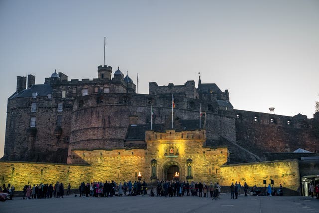 Edinburgh Castle illuminated in yellow light at the 2027 Tour de France launch event