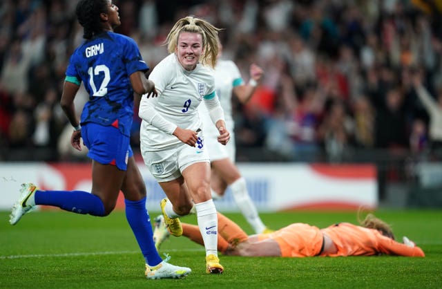 Lauren Hemp celebrates scoring against the United States