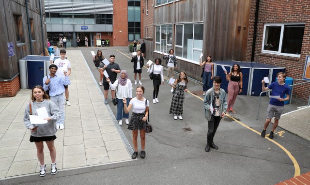 Students socially distance at Peter Symonds College, Winchester, as they receive their A-level results