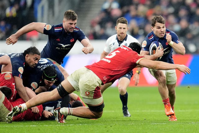 France’s Antoine Dupont (right) is tackled by Wales’ Dafydd Jenkins 