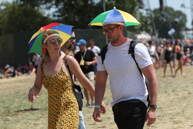 Festival-goers in the hot weather at 2019 Glastonbury festival (Yui Mok/PA)