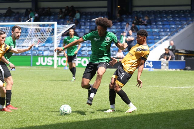 Grenfell AFC player Caleb French moves past a player during a match against Westbourne FC