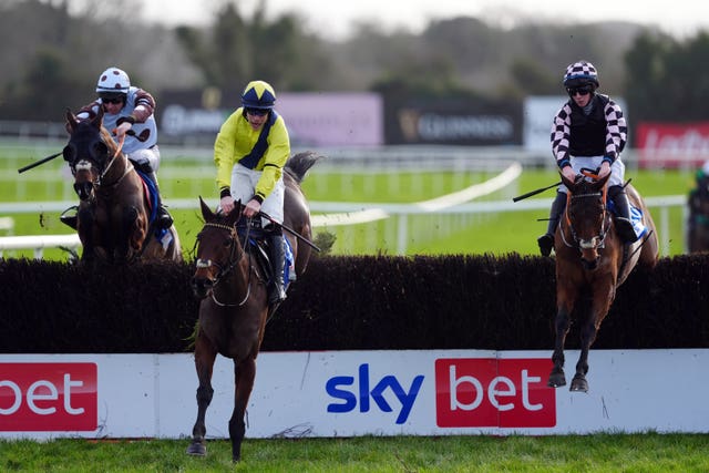 Nine Graces (centre) jumps the final fence at Punchestown